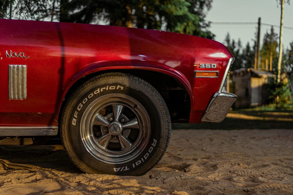Close-up of a classic Chevrolet Nova car with BF Goodrich tires.