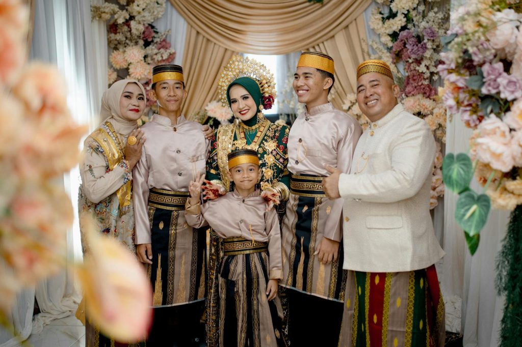 A Bugis family dressed in traditional attire during a wedding in Kendari, South East Sulawesi.