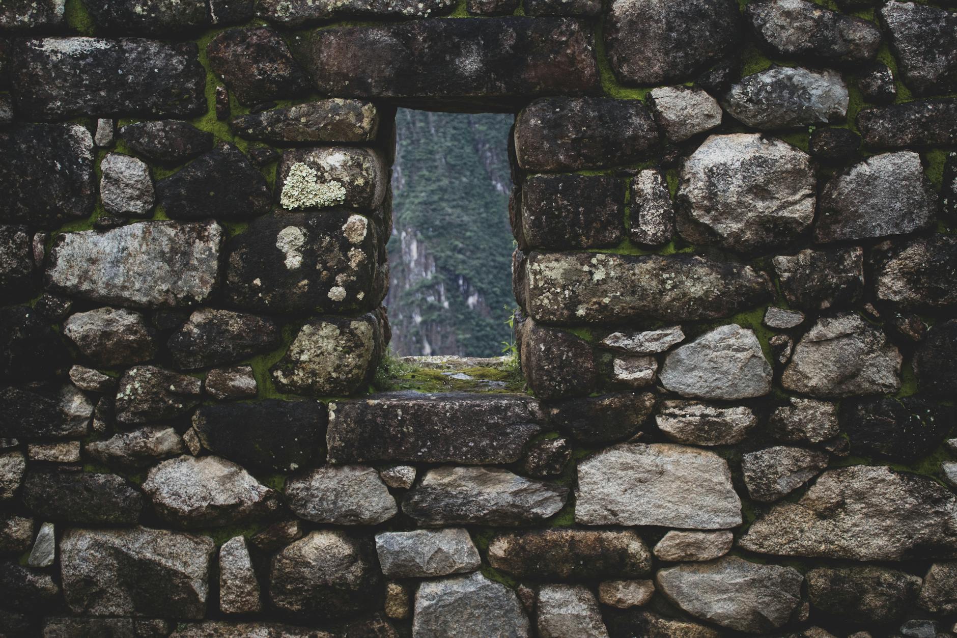 Stone wall with a view of ancient Inca architecture in Cusco, Peru.